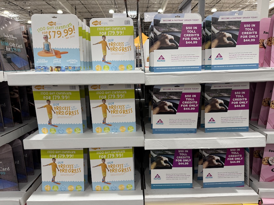 Goldfish Swim School $100 gift certificates on the Costco gift card display.