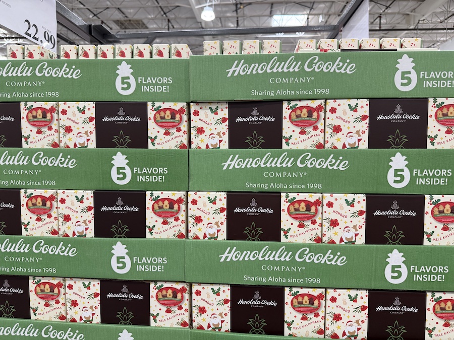 Festive Hawaiian shortbread cookies shaped like pineapples in a holiday box.