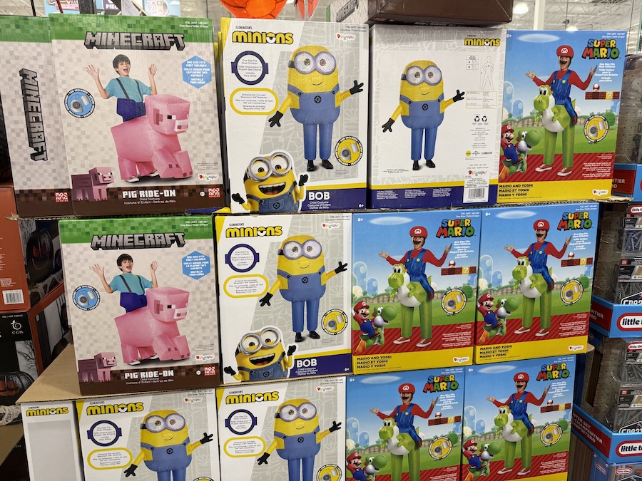 Inflatable Costumes featuring Minions, Minecraft, and Super Mario characters displayed in large boxes.