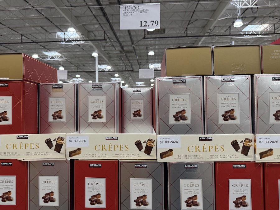 Crisp rolled crepes filled with creamy milk chocolate, displayed in a premium box.