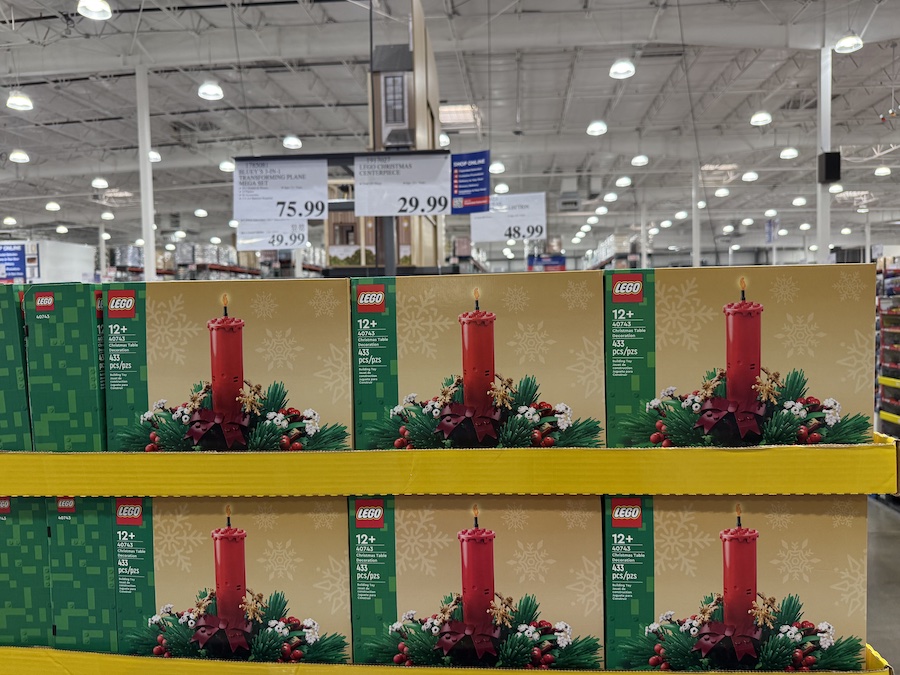 LEGO Christmas Centerpiece Set boxes stacked neatly in the toy aisle under bright lighting.