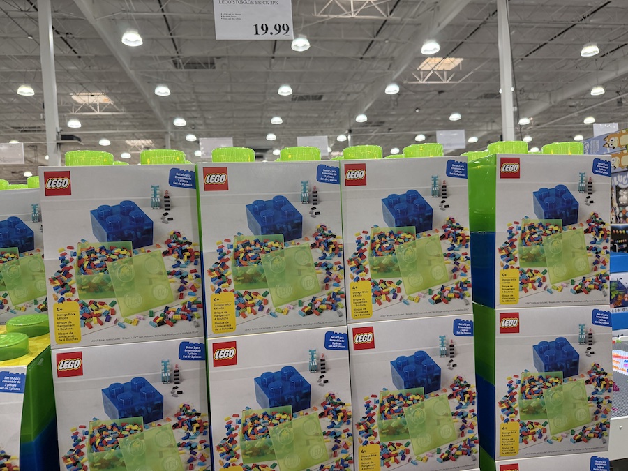 LEGO Storage Brick 2-pack sets in assorted colors stacked high on the toy shelves.