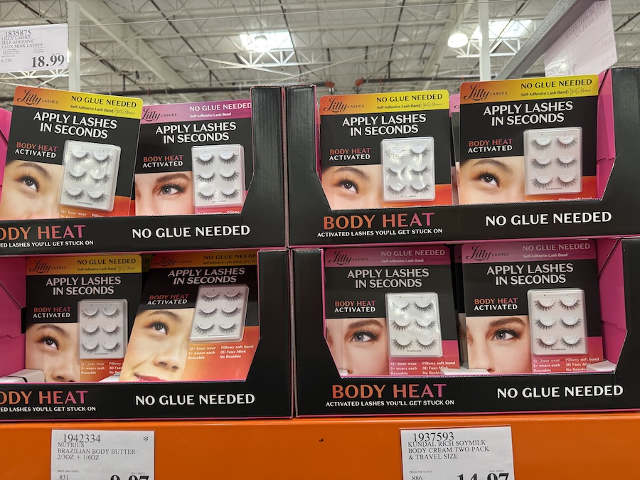 Close-up of dramatic faux mink lashes in their packaging with adhesive strip visible.