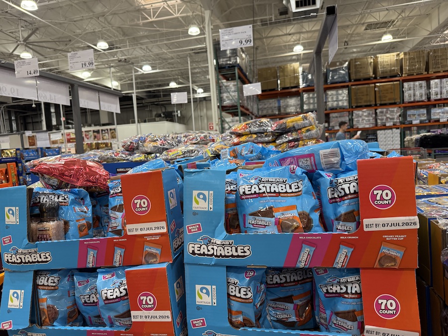 MrBeast Feastables Assorted Chocolate Variety Packs stacked on pallets with bright blue wrappers.