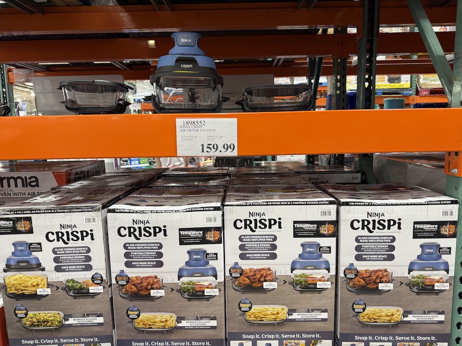 Compact air fryer set with glass containers displayed on a countertop.