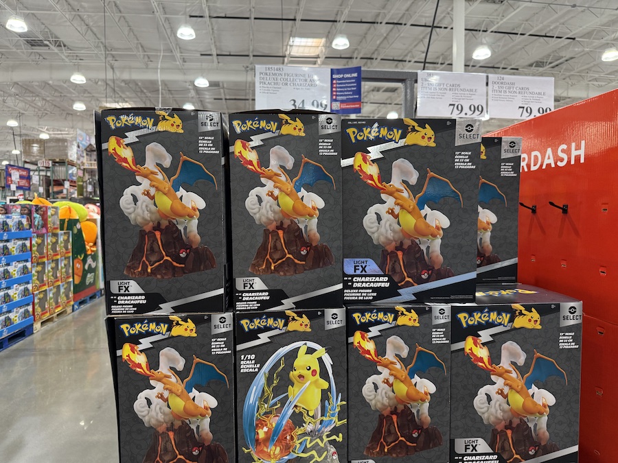 Pokémon Pikachu and Charizard 13-inch Deluxe Collector’s Statues on a Costco shelf.