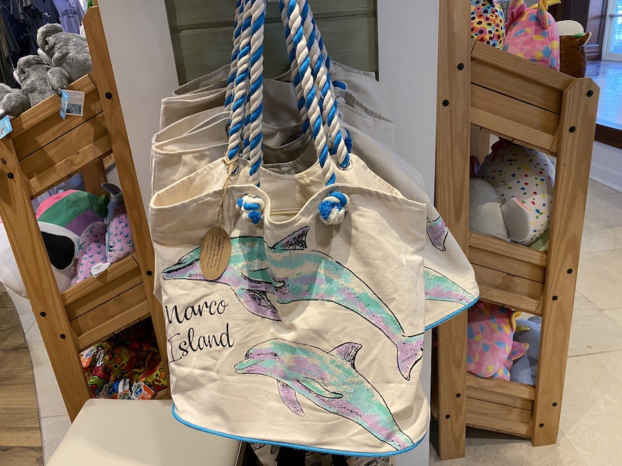 Nautical tote bags printed with colorful Marco Island dolphins.