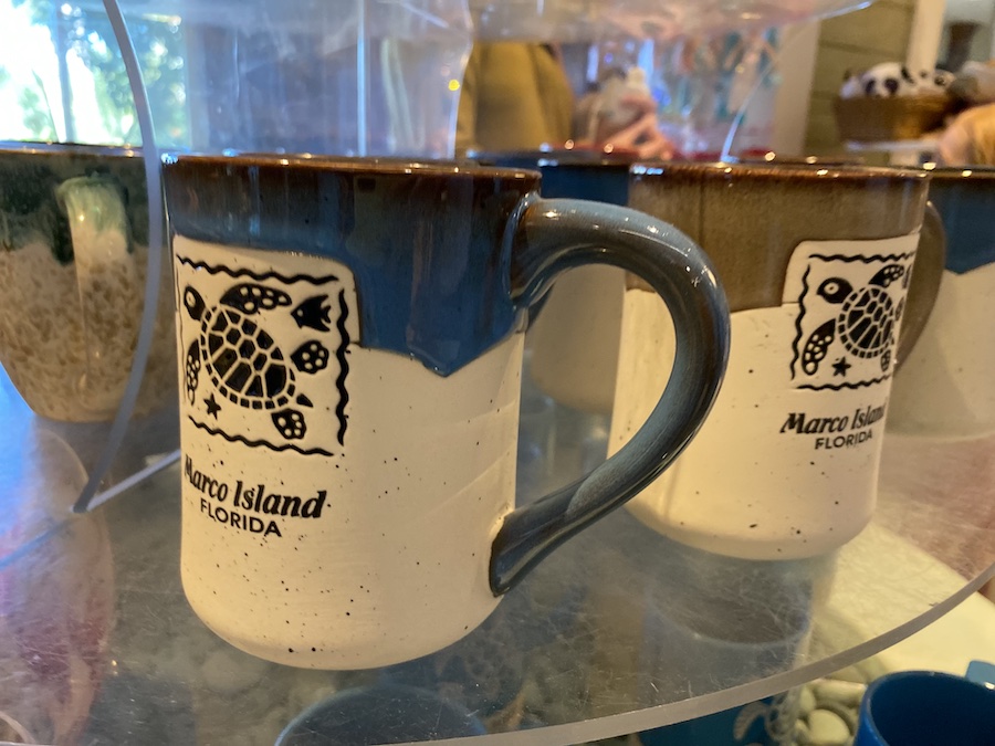 Ceramic coffee mug with a retro-style stamp and the inscription "Marco Island, Florida".