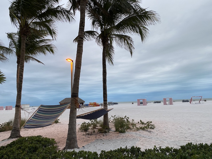 Colorful beach chairs and umbrellas lined up along Marco Island’s scenic coast.