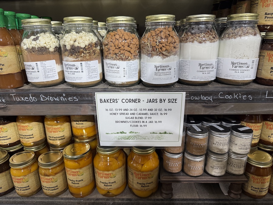 Cookie baking mixes in glass jars decorated with labels.