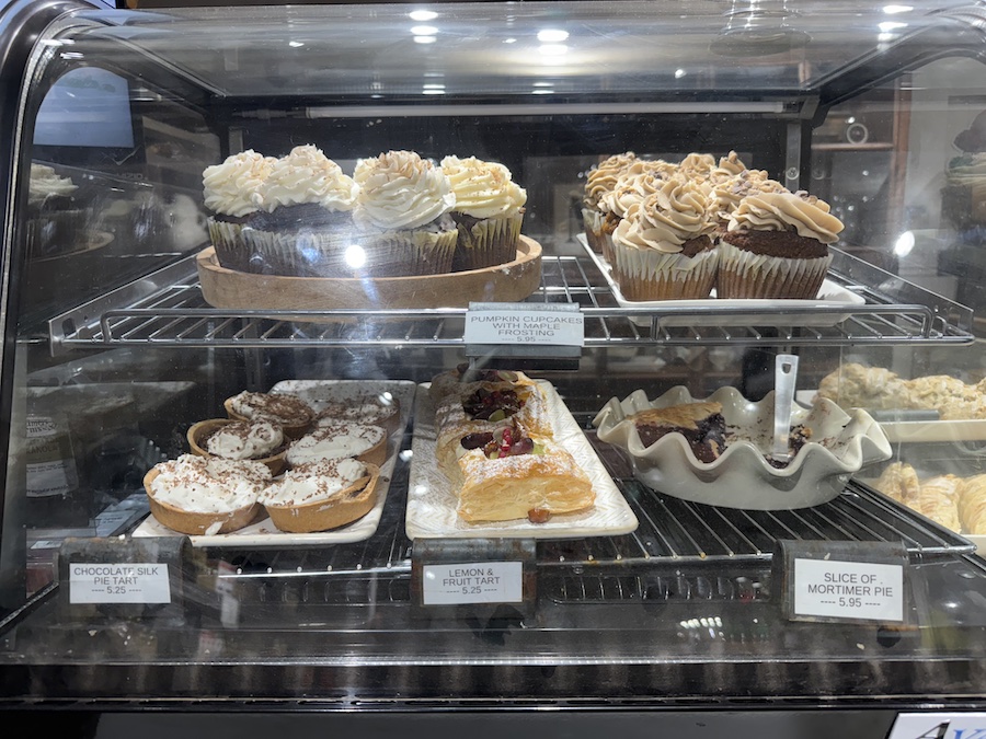 Shelves filled with homemade sweets, pies, and baked desserts.