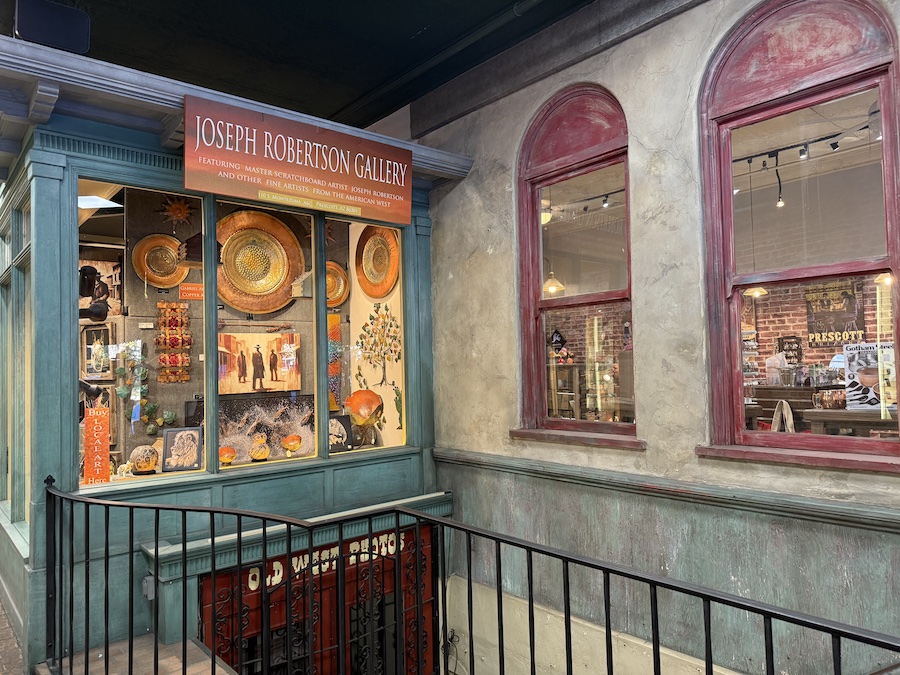 Colorful art gallery in downtown Prescott showcasing vibrant paintings and sculptures by local artist Joseph Robertson.