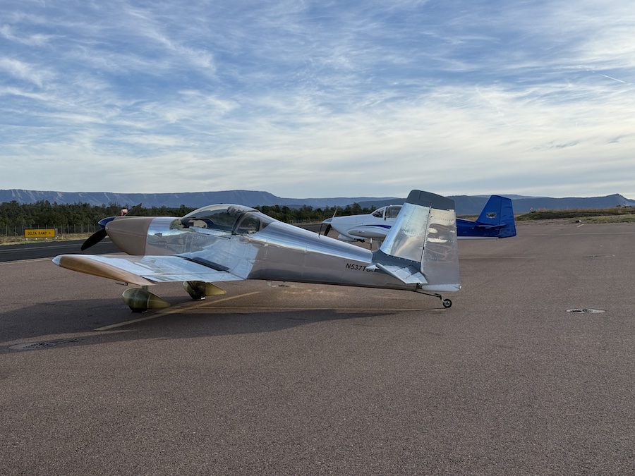 Silver airplanes parked at Payson Airport, shining under the Arizona sun with clear blue skies in the background.