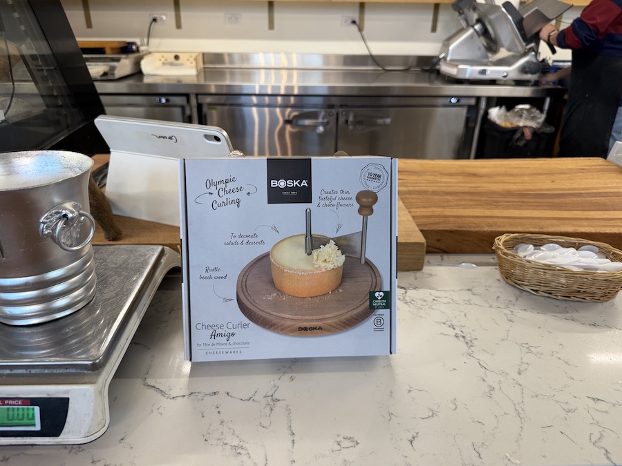 Elegant Boska cheese slicer on a marble countertop.