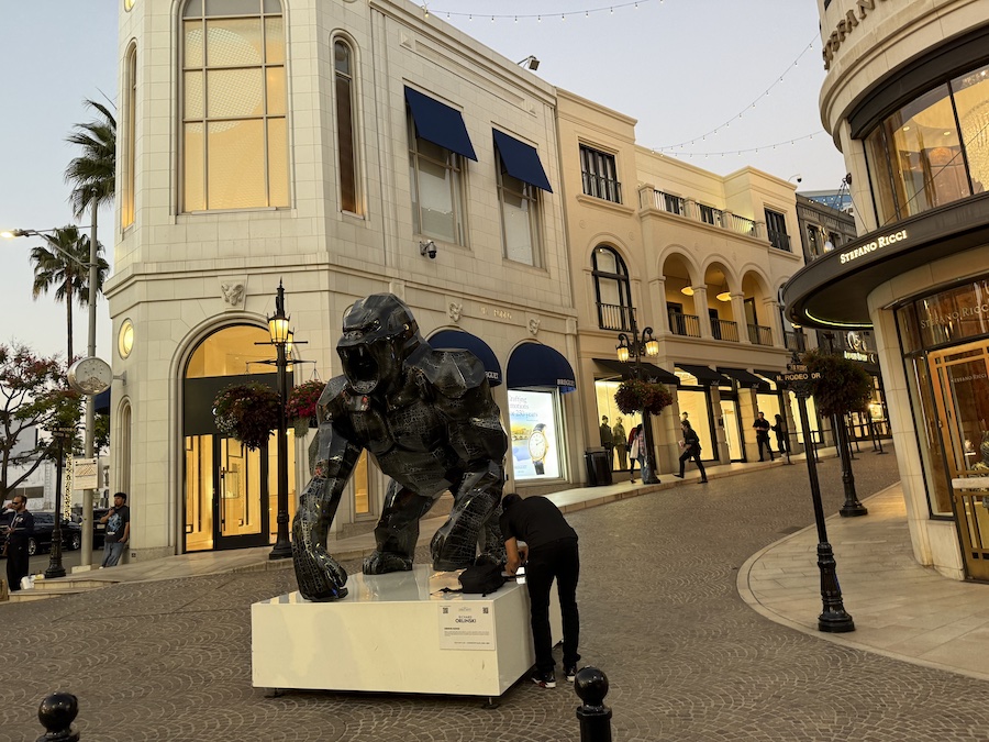 An outdoor scene in a luxurious pedestrian shopping district.