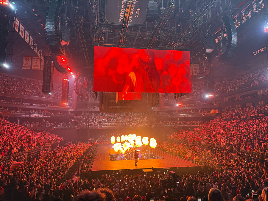 Billie on the screens in red tones