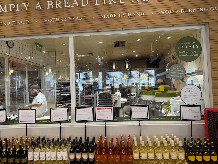 Artisan bakers preparing fresh loaves in Eataly LA’s open bakery