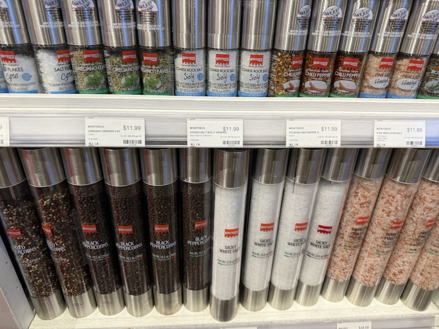 Close-up of Montosco salt and pepper grinders with elegant glass mills