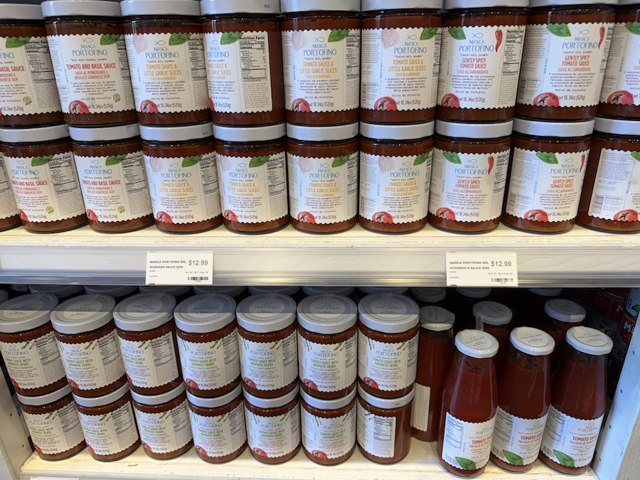 Elegant bottles of Niasca Portofino pasta sauce with premium packaging inspired by the Ligurian coast.