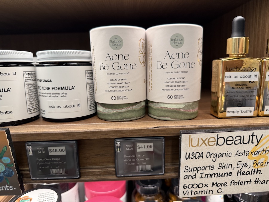 Balance Blends herbal formulas for acne relief on a bright and clean wellness display.