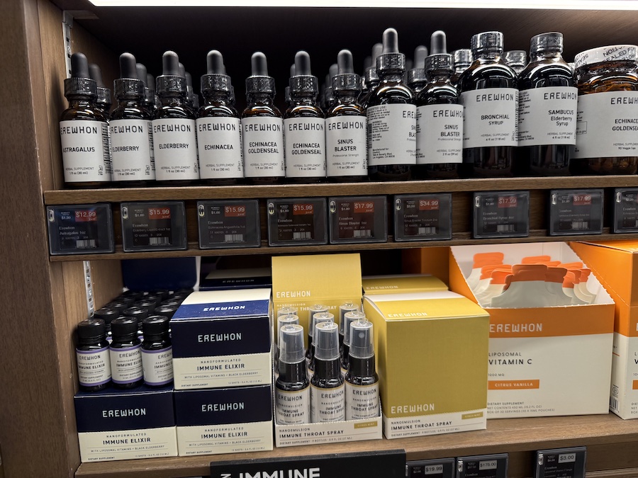 Erewhon supplements neatly displayed on store shelves at Erewhon Manhattan Beach