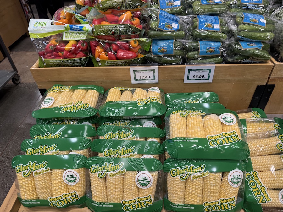 Colorful and fresh seasonal vegetables stacked in the produce section.