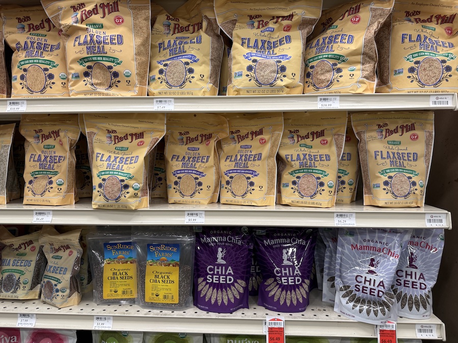 Bags of Bob’s Red Mill flaxseed meal stacked neatly in the baking aisle.