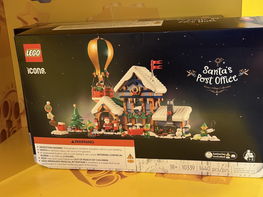 The LEGO Santa’s Post Office set featuring elves, gift boxes, and a cozy snowy workshop scene.