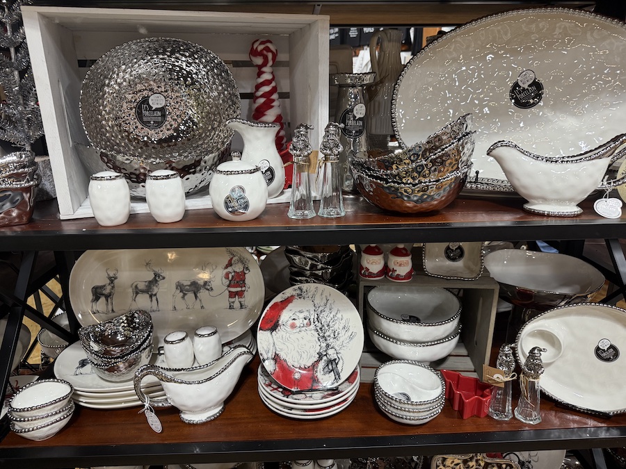 Elegant Christmas tableware in a seasonal display at Spice Traveler in Prescott.