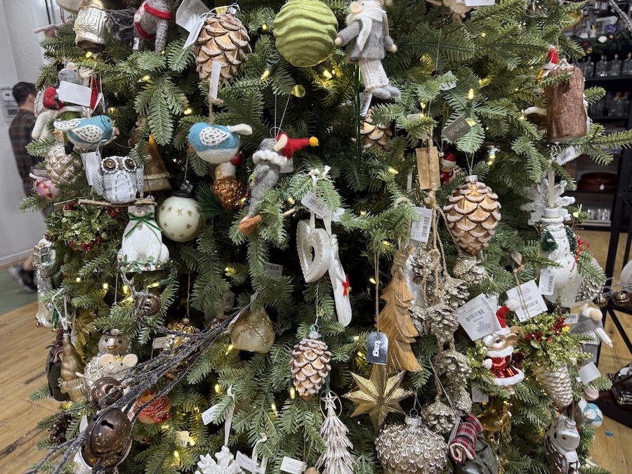 Themed holiday trees inside Spice Traveler are brilliantly adorned with colorful Christmas decorations and festive accents