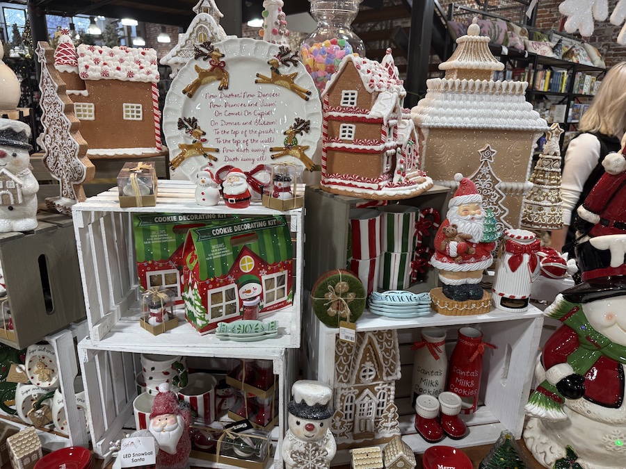 Red and green holiday decorations arranged in a charming boutique-style setup at Spice Traveler.