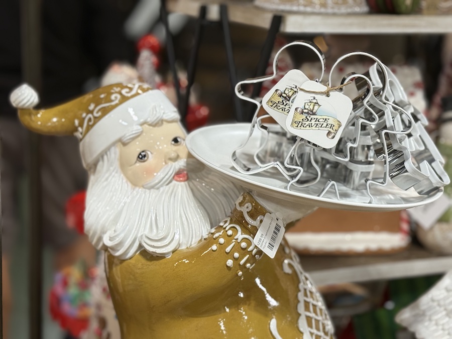 Gingerbread Santa statuette made of festive resin, displayed with other holiday kitchen accessories.