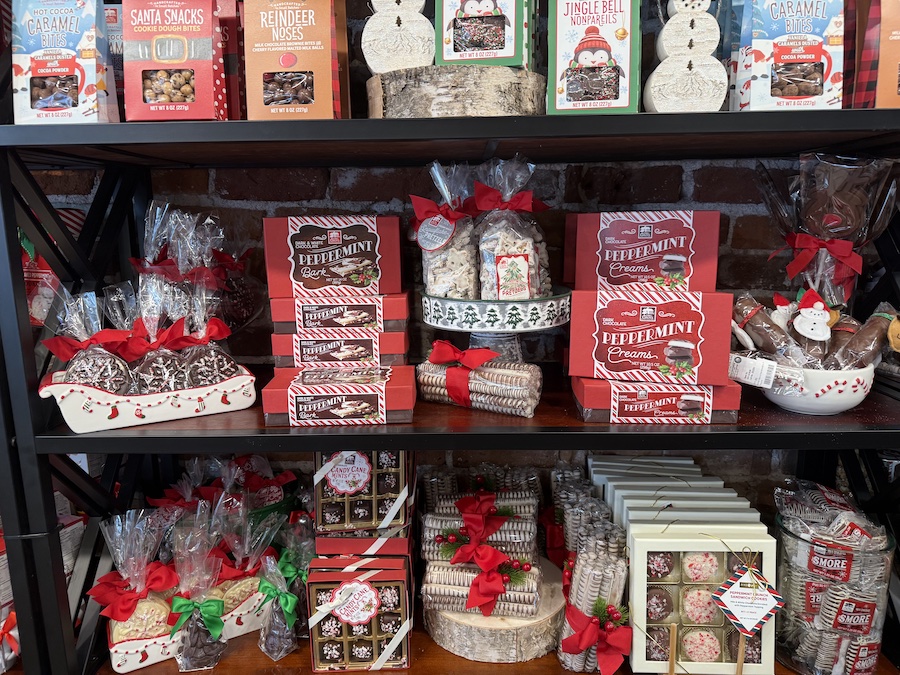 Long Grove Dark & White Chocolate Peppermint Bark packaged beautifully and displayed among Christmas sweets.
