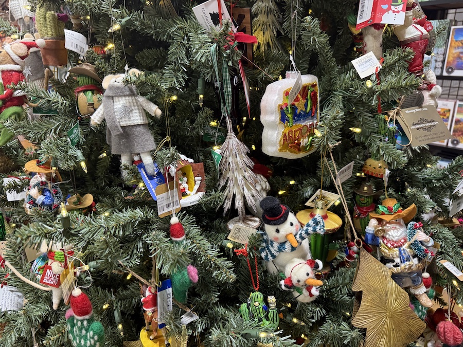 Southwest-themed Christmas ornaments inspired by Arizona motifs, displayed on a regional holiday tree.