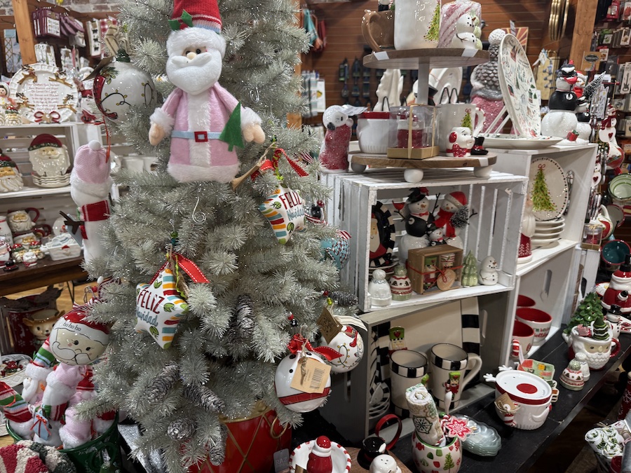 Glittering Christmas ornaments and seasonal home décor showcased under warm lighting in Spice Traveler.