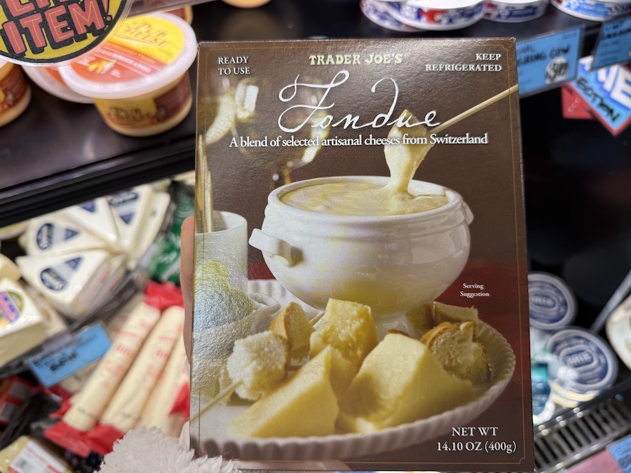 Close-up of Trader Joe’s Swiss-style fondue kit, packed in festive cream boxes.