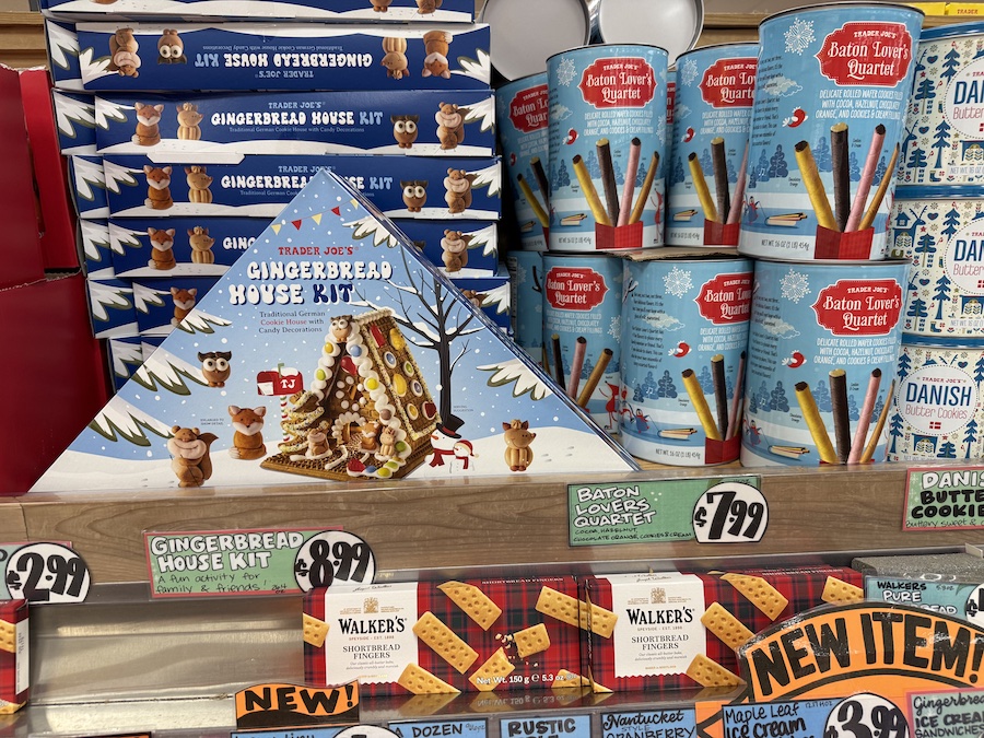 A holiday baking section featuring gingerbread house kits and cookie gift tins, ideal for festive activities and gifting.