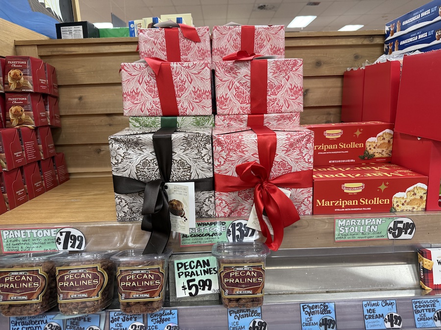 Traditional Italian panettone and German stollen breads stacked for the season — wrapped beautifully for holiday gifting.
