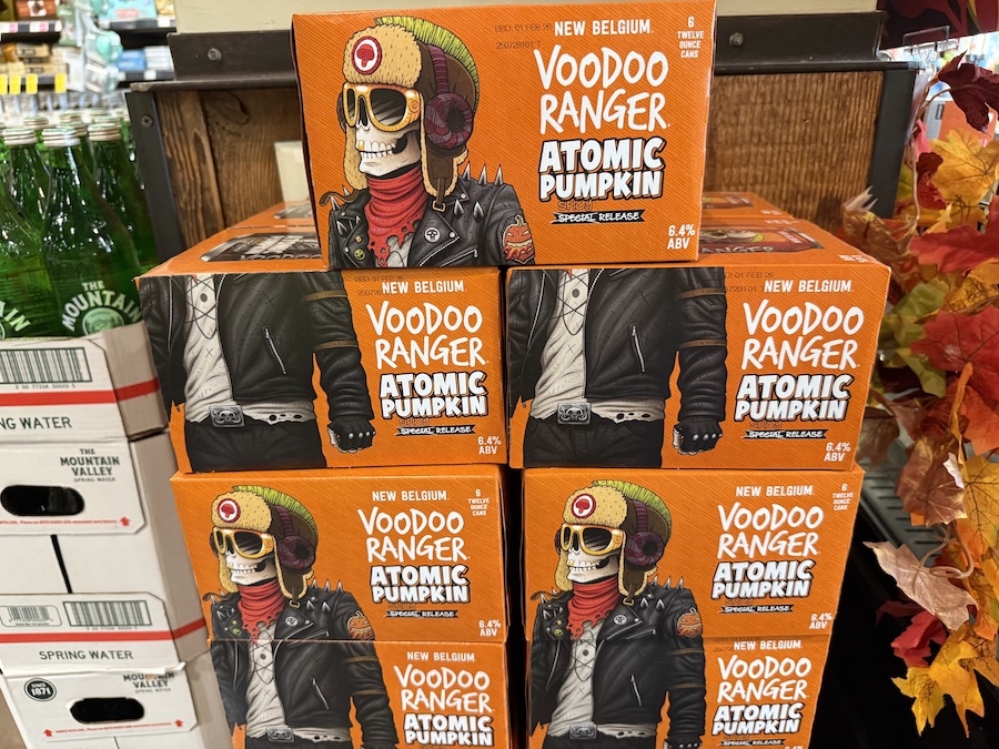 Cans of New Belgium’s Voodoo Ranger Atomic Pumpkin Ale with bright orange labels and a spicy seasonal twist.