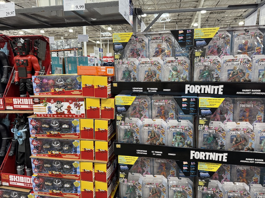 A brightly colored Fortnite gift set featuring five articulated action figures with accessories, displayed in clear plastic packaging.