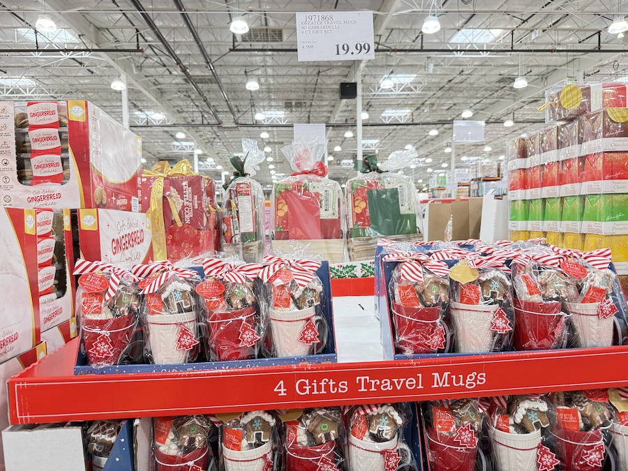 A cozy holiday-themed gift set including a sweater-patterned travel mug and Ghirardelli chocolates.