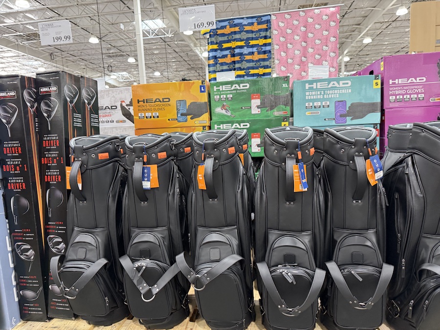 The elegant Stitch Golf SL4 cart bags are displayed vertically, showcasing their clean lines and premium detail.