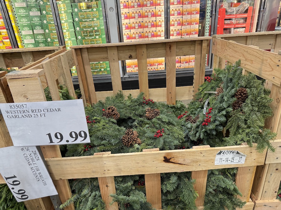 Large 28-inch mixed evergreen wreaths on display at Costco, made with fresh, high-quality winter greens.