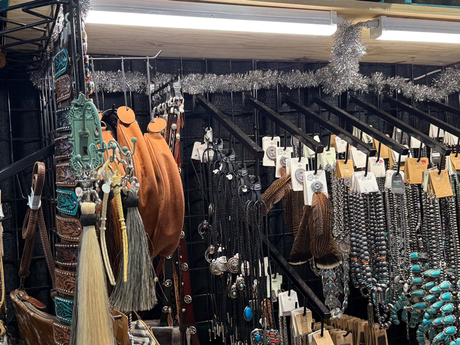 Handmade necklaces and leather bags with tassels at the Christmas 2025 event