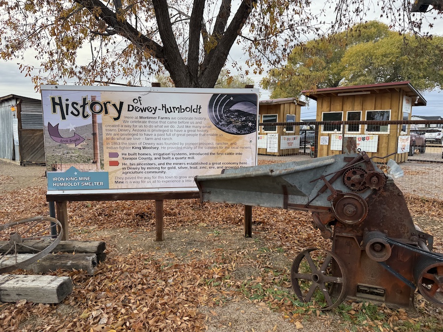 An informational banner featuring the history of Dewey-Humboldt, displayed among the farm attractions.