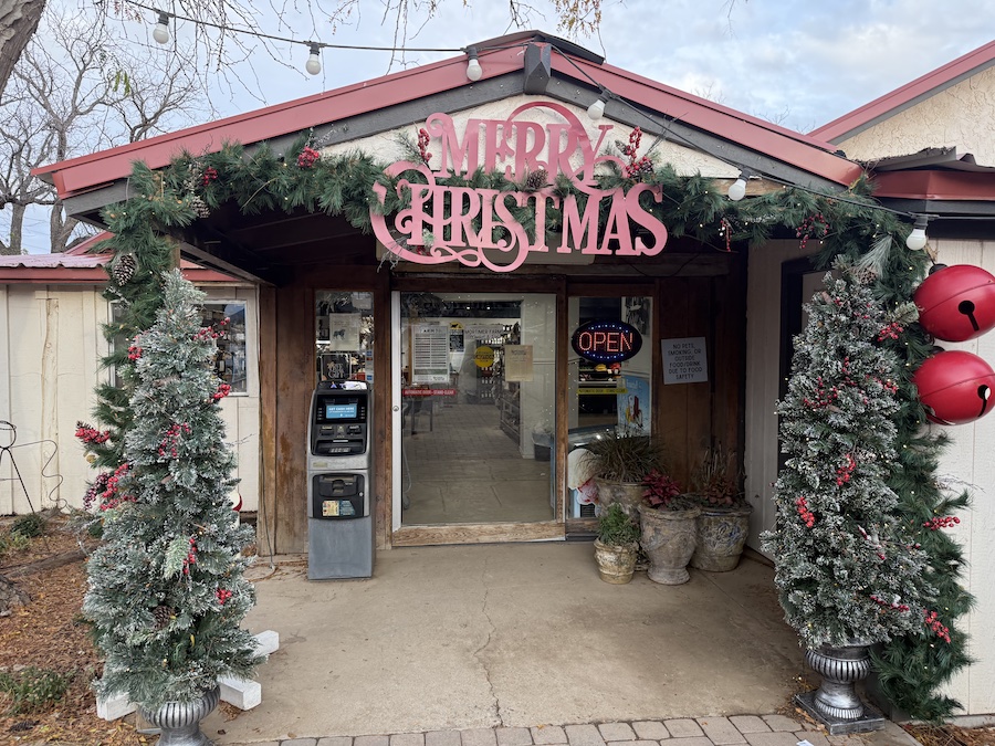 The exterior entrance to Mortimer Farms store decorated for the Christmas season.