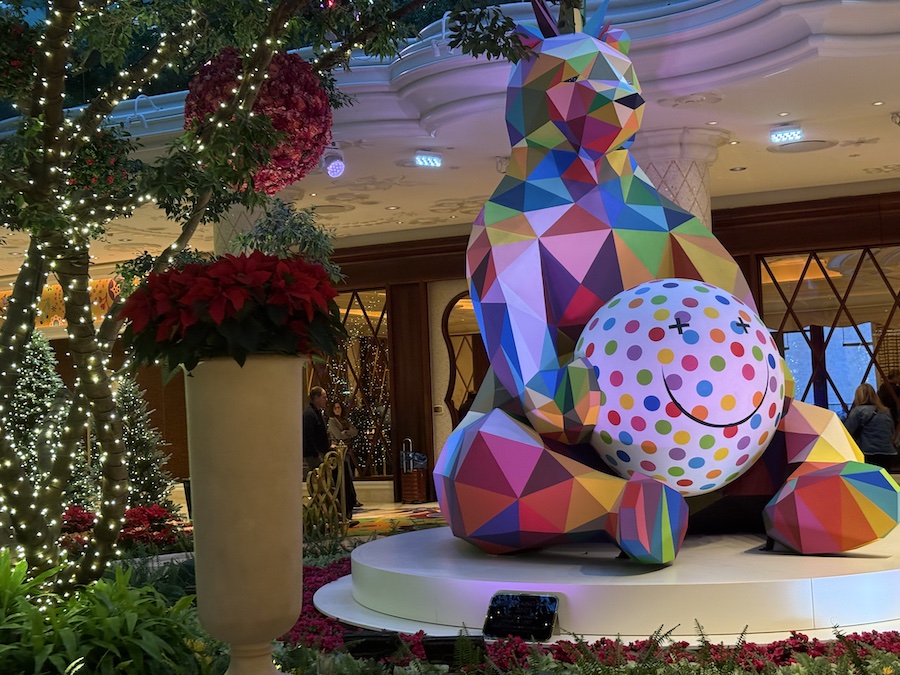 A full view of the bear sculpture integrated into a holiday-themed display.