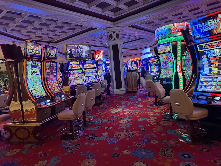 A wider view of the gaming area, where slot machines await players.