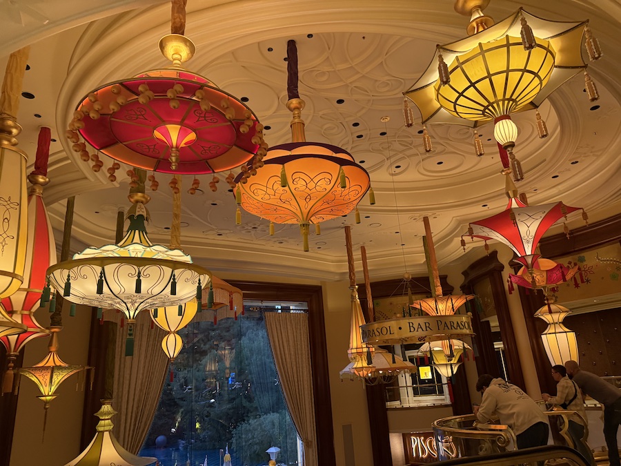 Bar Parasol decorated with warm lighting, and elegant accents complementing the bar’s whimsical design.