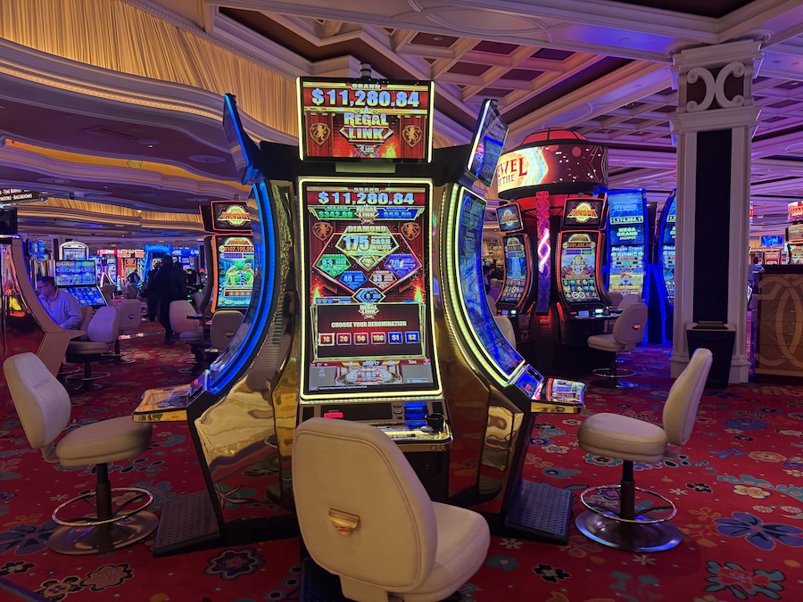 Close-up of slot machines with their glossy surfaces.